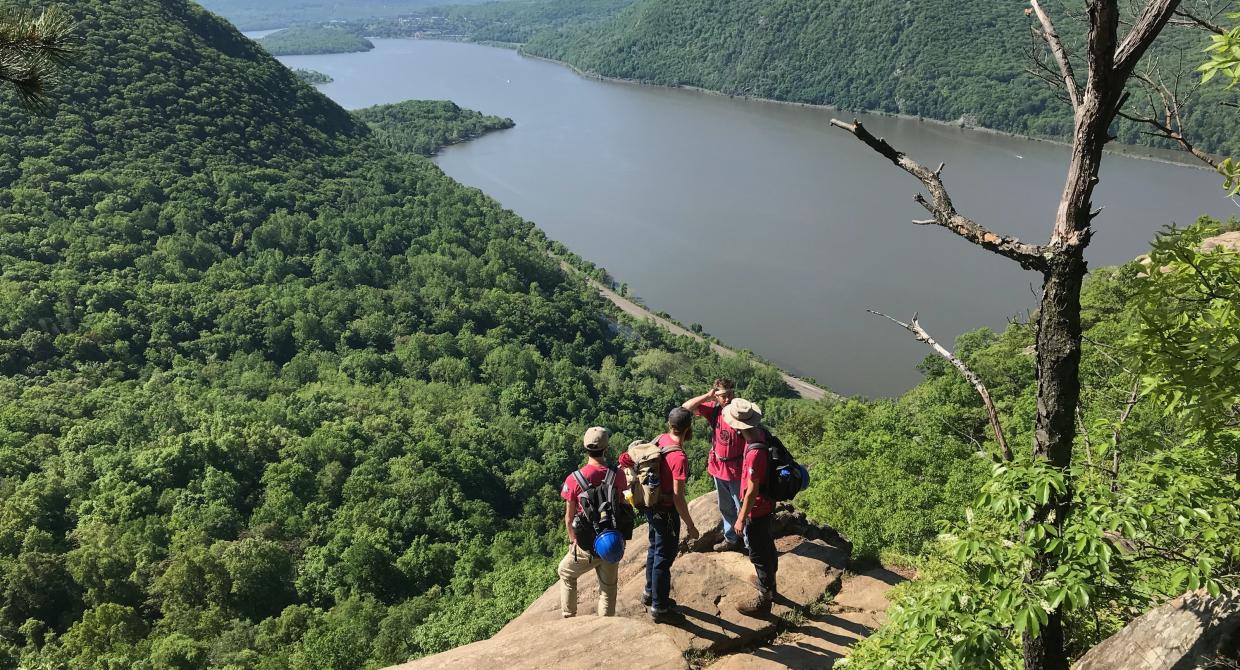 The Trail Conference's Taconic Crew Looks Out Over the Hudson River from Breakneck Ridge. Photo Credit: Erik Mickelson.