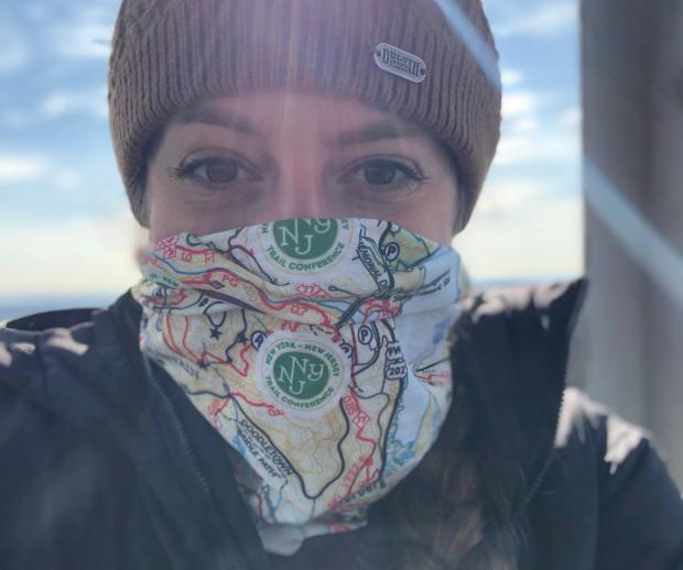 Hiker with a Harriman-Bear Mountain Trails Map Neck Gaiter. Photo by Diana Richards.