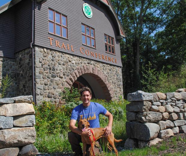 Dia the Conservation Detection Dog and her handler Joshua Beese. Photo by Heather Darley.